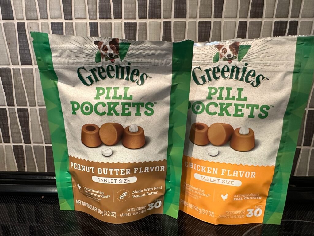 Two bags of Greenies Pill Pockets for dogs, peanut butter flavor and chicken flavor, tablet size